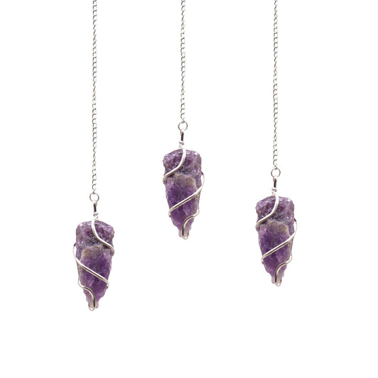 A natural raw Amethyst crystal point pendulum suspended from a delicate silver-tone chain for divination and dowsing.