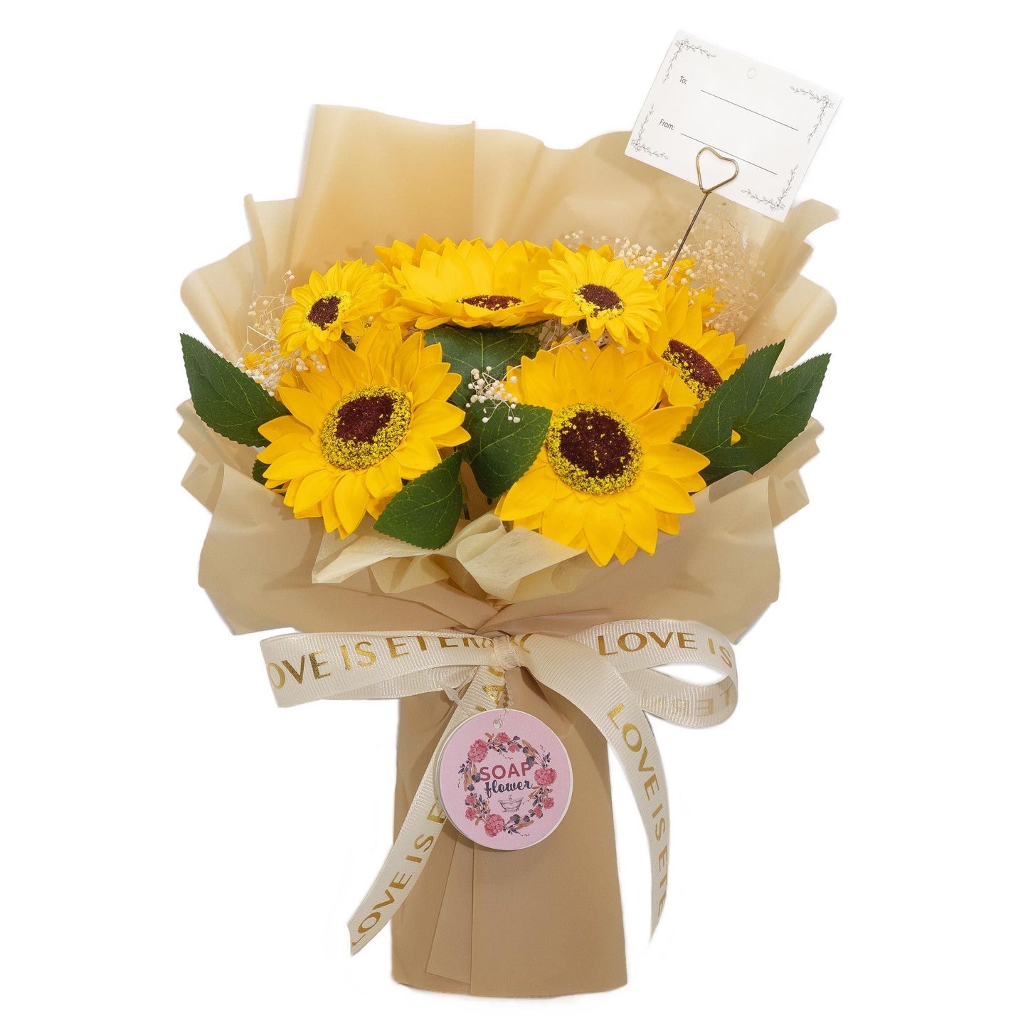 Large bouquet of realistic yellow soap sunflowers wrapped in gold paper with a decorative Love is Eternal ribbon.