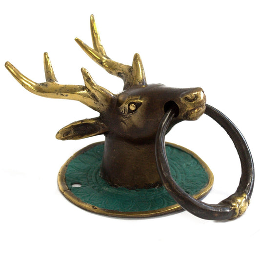 Classic brass door knocker featuring a detailed stag head design with a rustic, timeless finish.