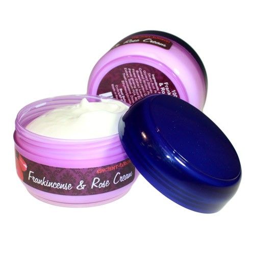 Close up of a jar containing rich white frankincense and rose face cream.