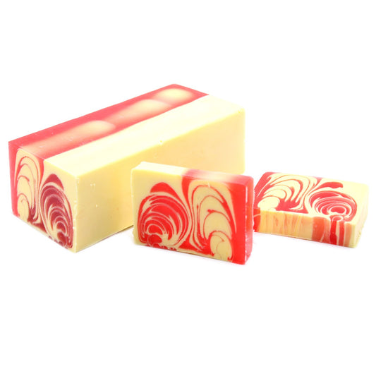 Large rectangular handcrafted strawberry soap loaf with a vibrant pink colour and textured top.