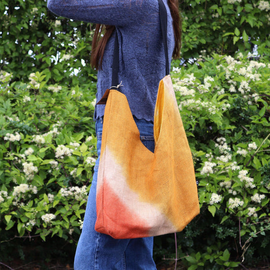 Handcrafted turmeric yellow shoulder tote bag made from a soft blend of jute and cotton.