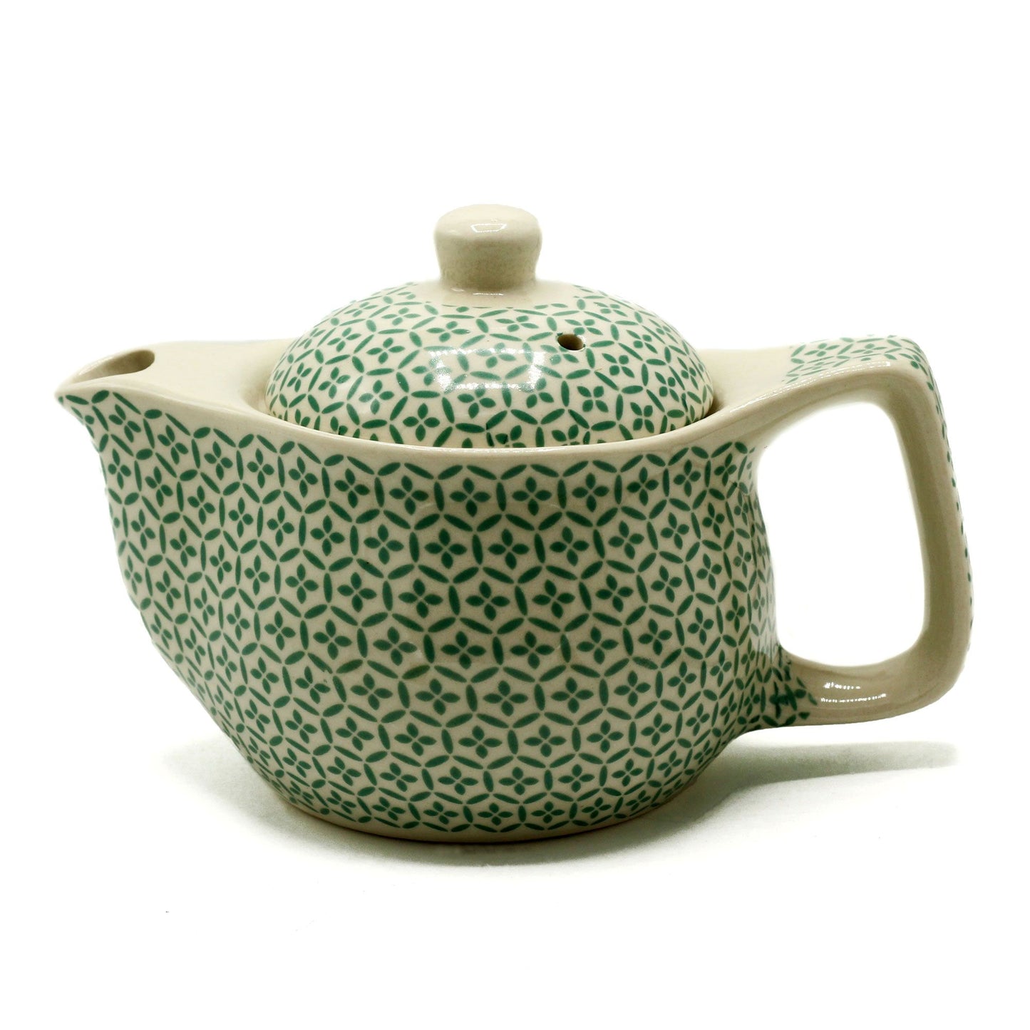 Small ceramic teapot featuring a vibrant green mosaic pattern with a classic handle and spout design.