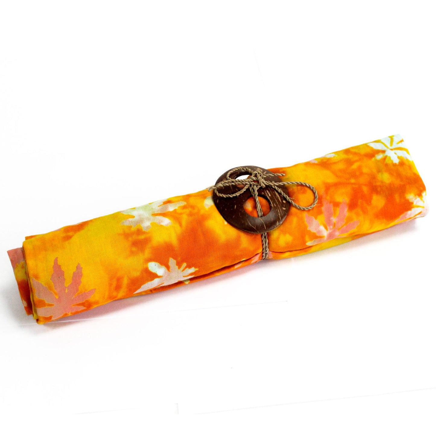 Bright orange sarong with white tropical leaf block print design and a decorative coconut shell buckle.