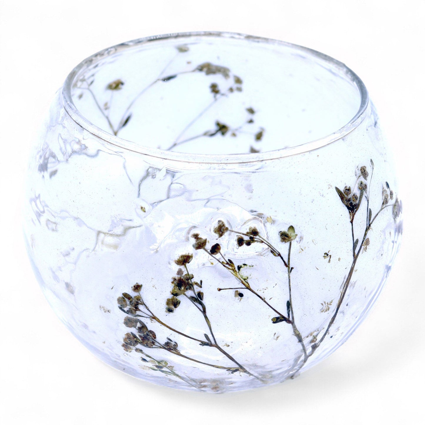Handcrafted glass bowl candle holder embedded with yellow margarita flowers and real dried blossoms.