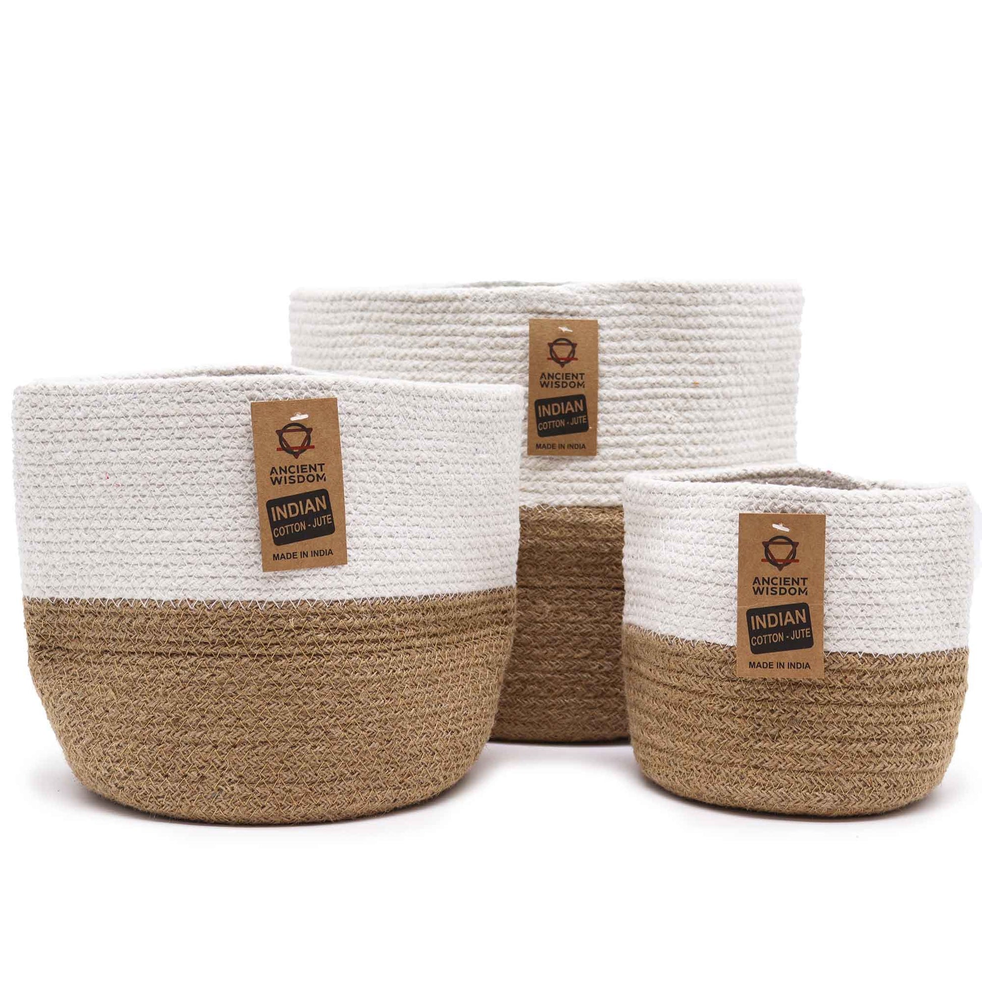 Three nested round white cotton rope storage baskets in varying sizes with a minimalist woven texture.