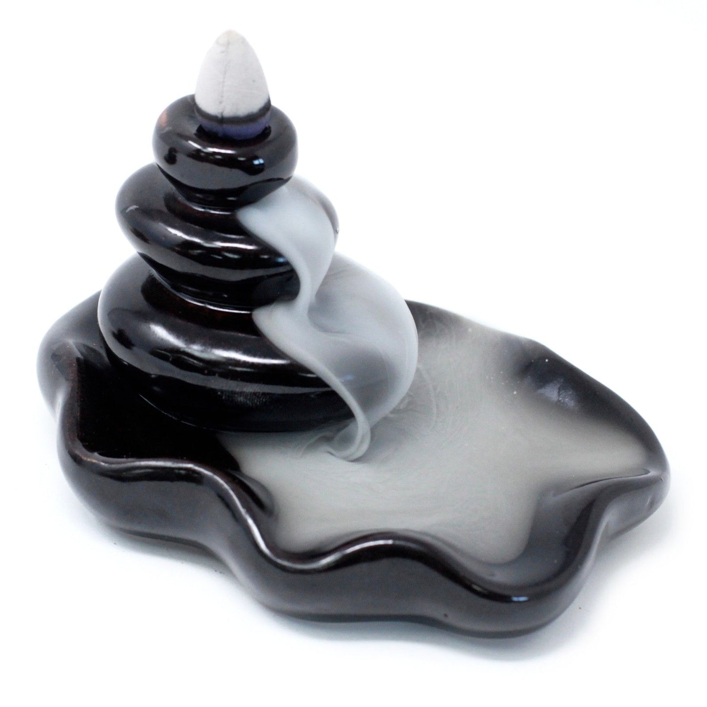Ceramic backflow incense burner featuring smooth stacked pebbles and a pooling reservoir for cascading smoke effect.