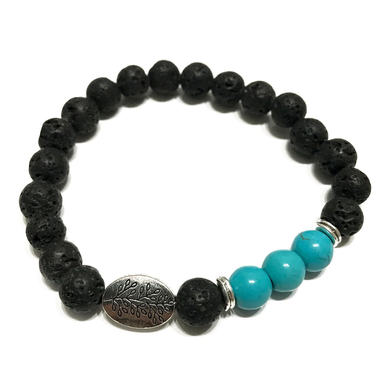 Handcrafted lava stone bracelet featuring dark porous beads and a vibrant turquoise leaf charm on an elastic cord.