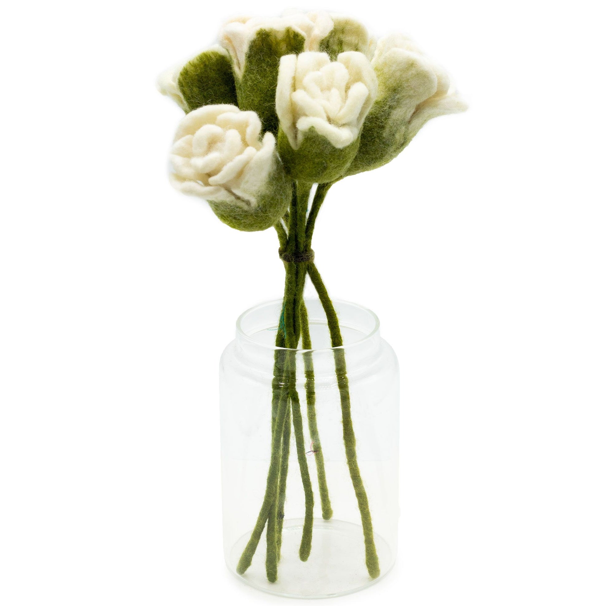 Set of six handcrafted white felt roses with realistic petals and green stems on a neutral background.