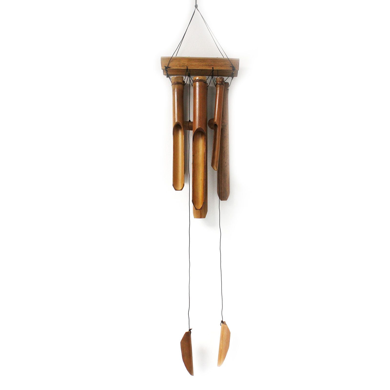Large natural finish bamboo windchime with six long tubes hanging from a wooden canopy in a peaceful setting.