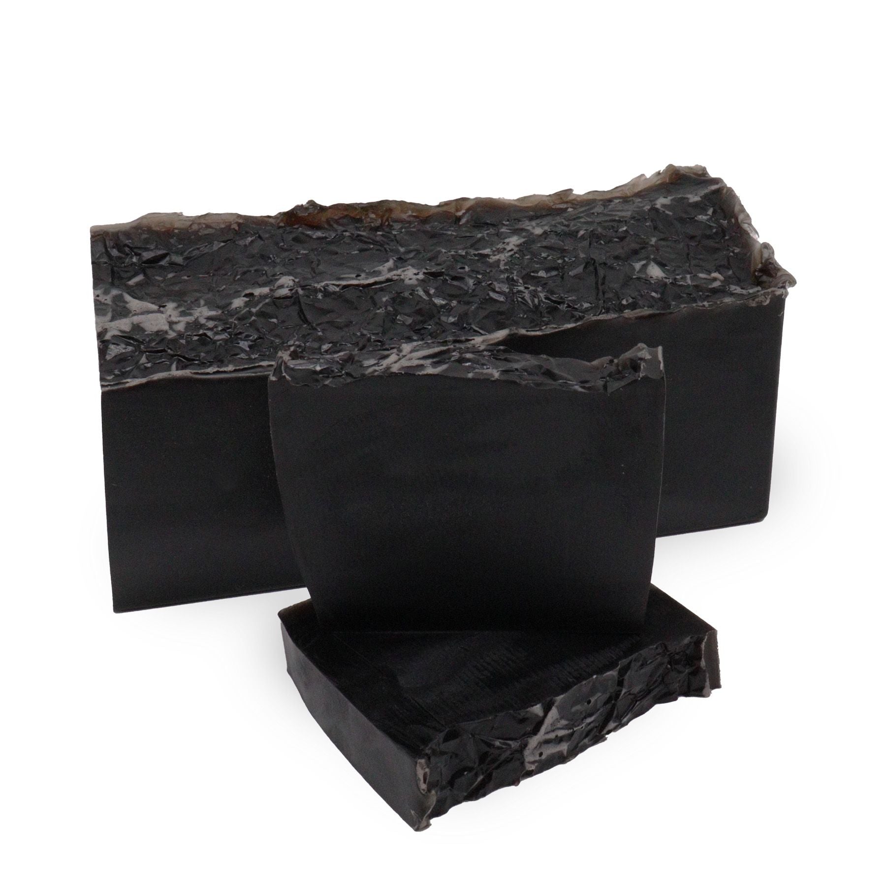 Hand-crafted soap loaf with a marbled dark and light texture, reflecting the Harmony Noir scent of white fig and vanilla.