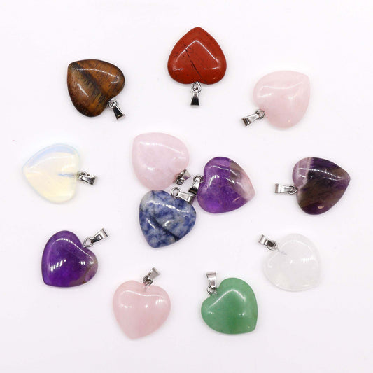 Twelve assorted colourful gemstone heart-shaped pendants, sized 20x6mm, displayed together.