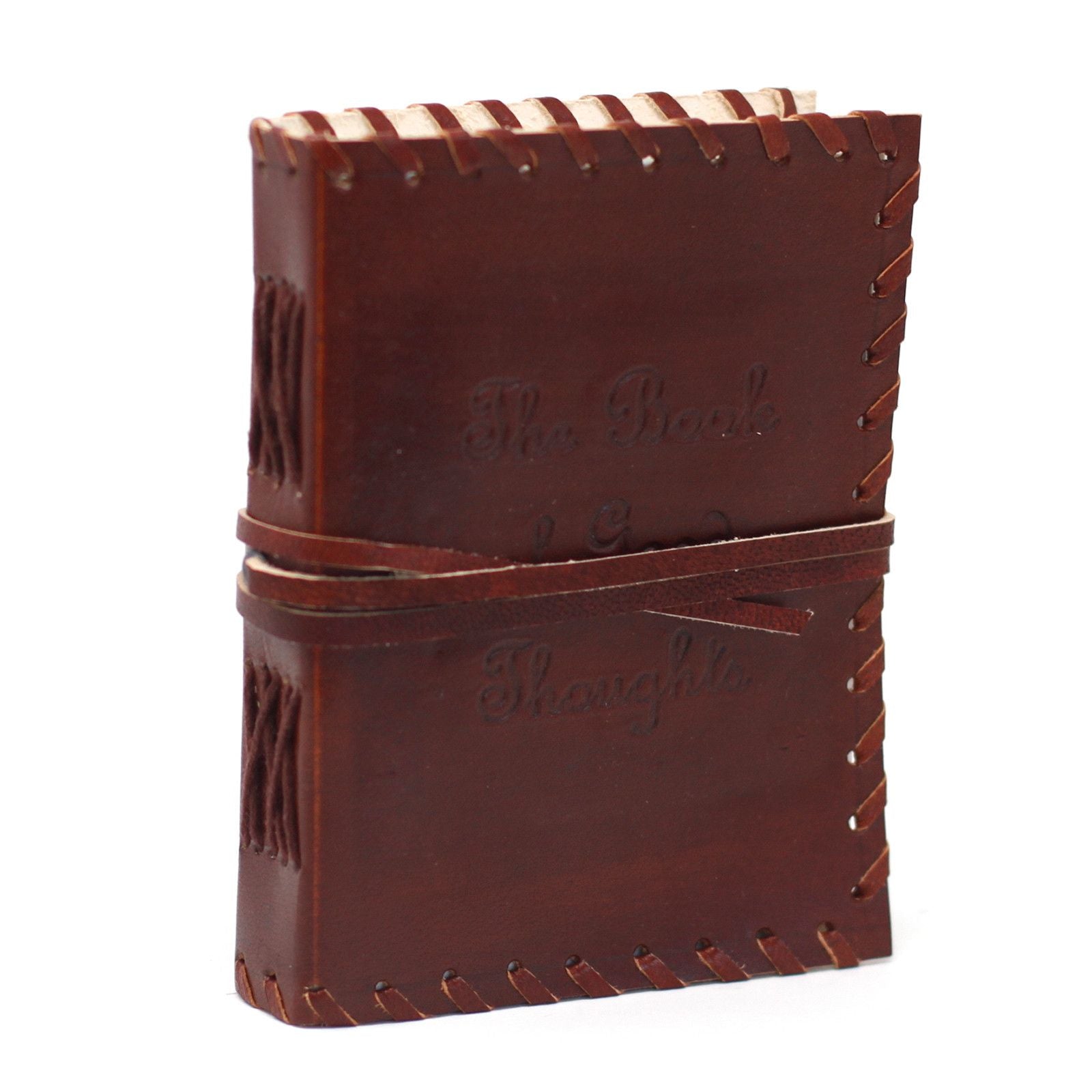 Handcrafted brown leather notebook with a wrap-around strap, metal buckles, and rustic burnt edges.