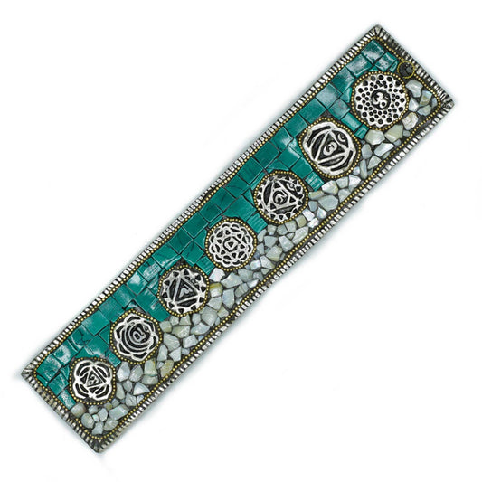 Handcrafted Tibetan-style incense holder featuring colourful symbols representing the seven chakras.