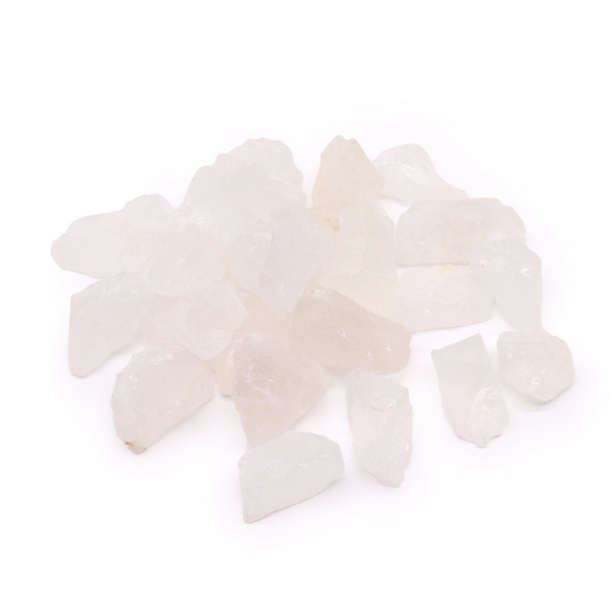 A collection of semi-translucent white raw rock quartz crystal points and fragments.