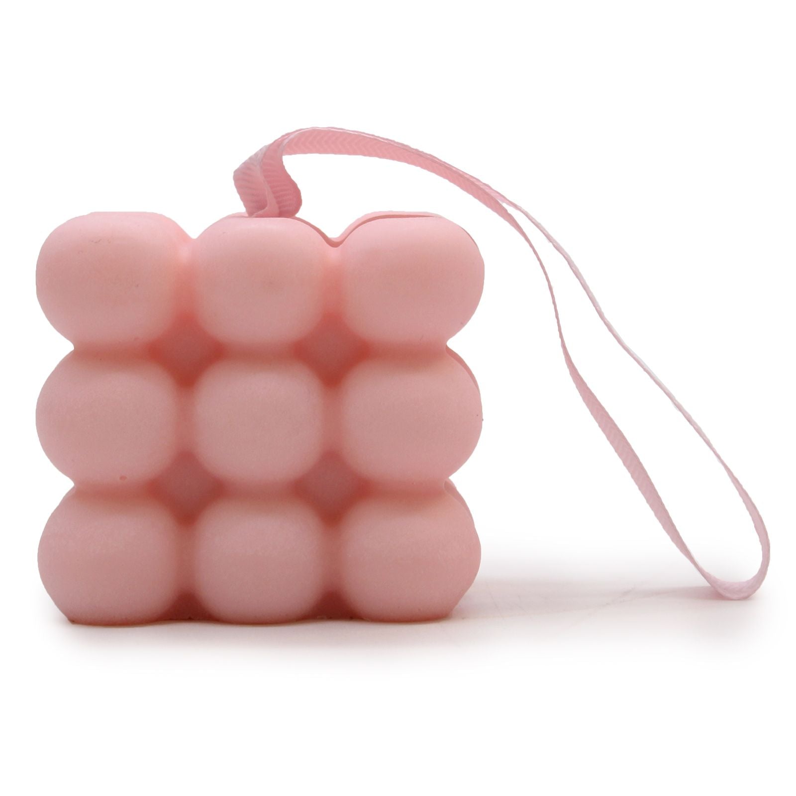 Cylindrical massage soap bar with raised nodules for muscle stimulation, infused with jasmine and patchouli.