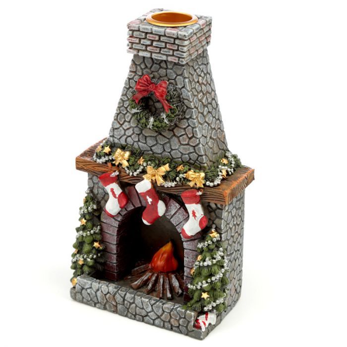 Festive red and green ceramic fireplace backflow incense burner with a miniature mantlepiece and warm holiday details.