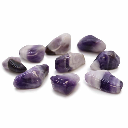 Polished medium-sized banded amethyst tumble stones showing natural purple hues and white quartz V-shaped patterns.