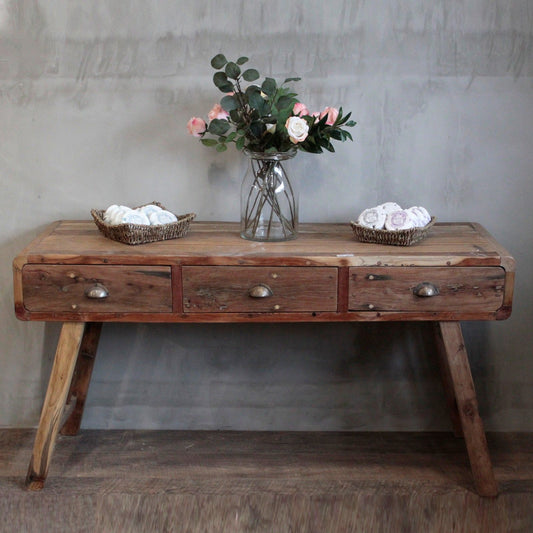Rustic hand-made console table crafted from colourful upcycled teak wood with three drawers and a natural finish.