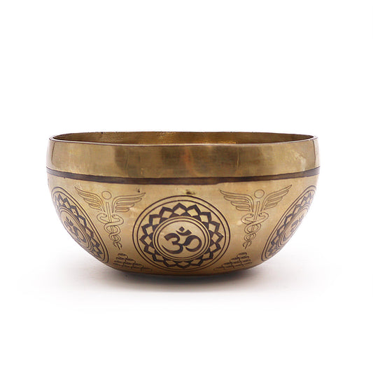 Handcrafted 16cm Tibetan singing bowl with intricate 7 Chakra engravings and a traditional brass finish.