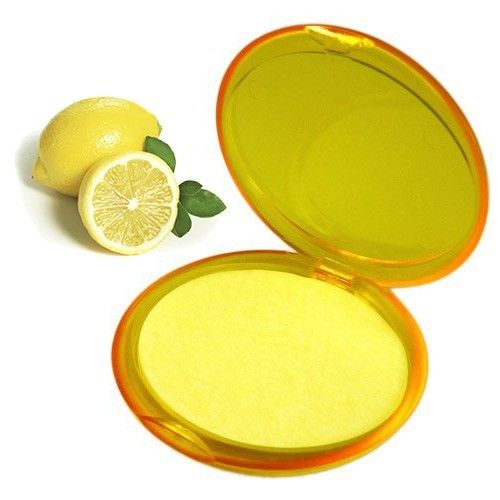 Travel-sized container of thin lemon-scented paper soap sheets for portable hand washing.