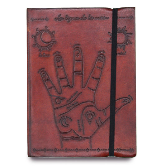 Small black vegetable leather notebook featuring an embossed gold palmistry hand design and a secure elastic strap.