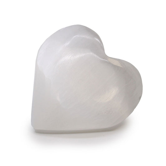 Smooth polished white selenite crystal carved into a heart shape showing its natural fibrous shimmer.