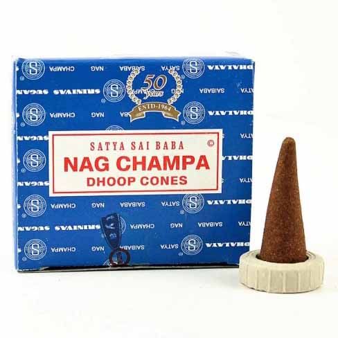 Smooth dark brown conical incense sticks known as Nagchampa dhoop cones displayed on a neutral background.