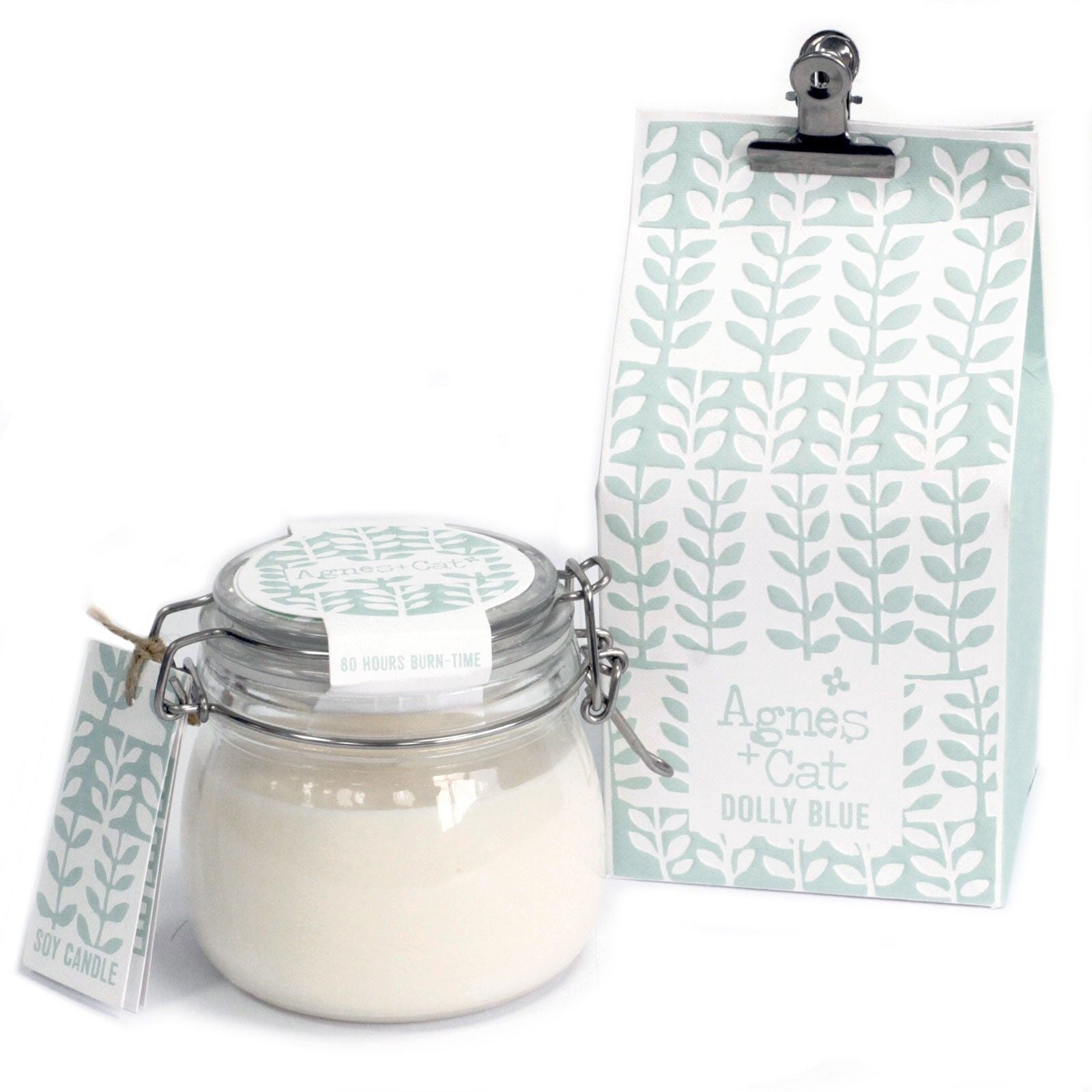 Large glass kilner jar candle filled with white soy wax and a single wick in a clean, minimalist setting.