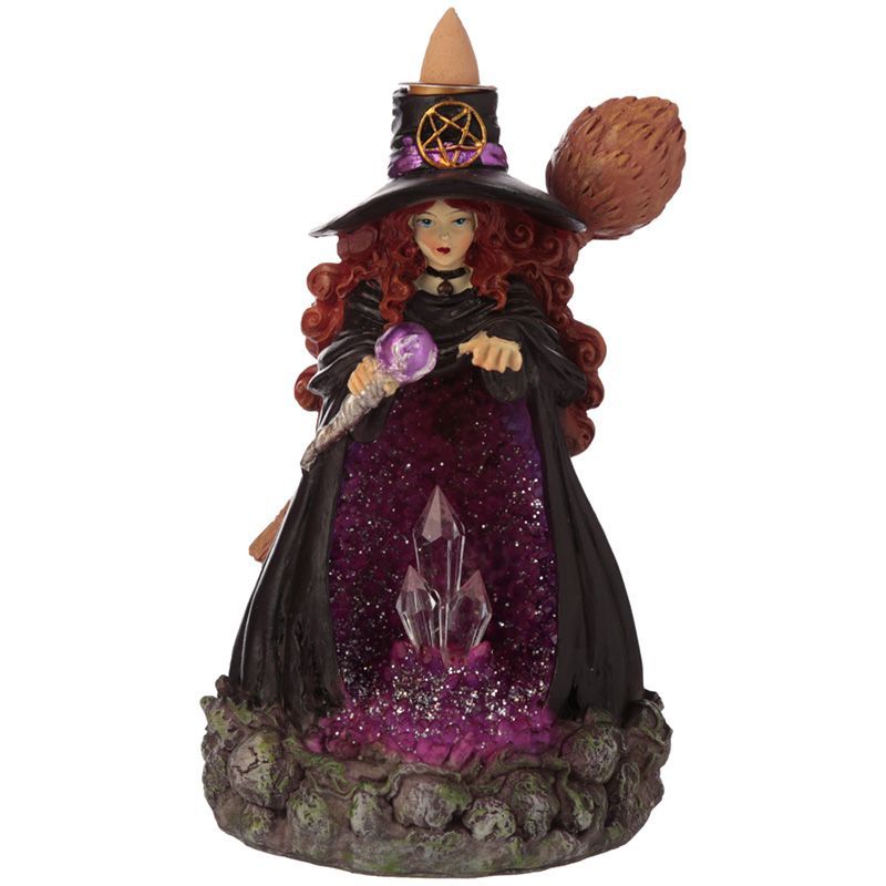 Intricate dark rocky cave incense burner with purple crystal-like interior lit by glowing LED lights.