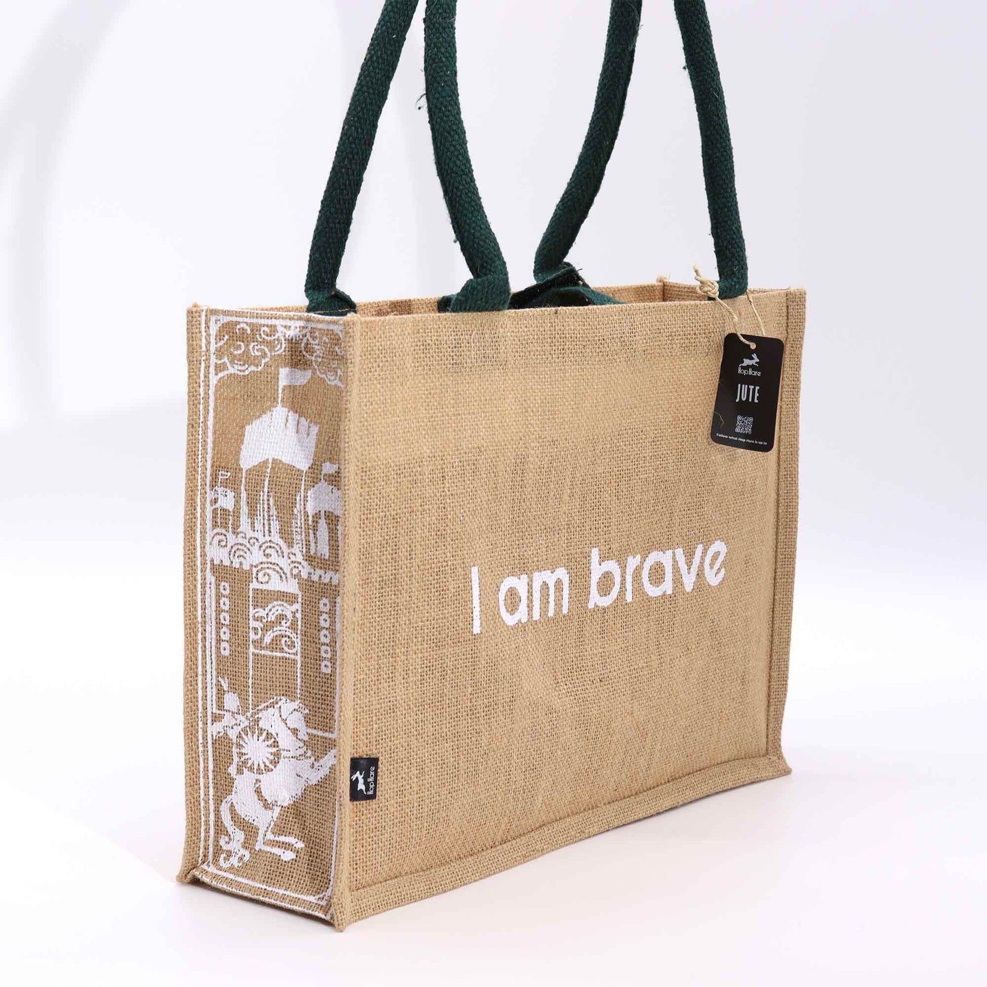 Large eco-friendly jute tote bag featuring a bold Knight of Swords tarot design and 'I am Brave' affirmation.