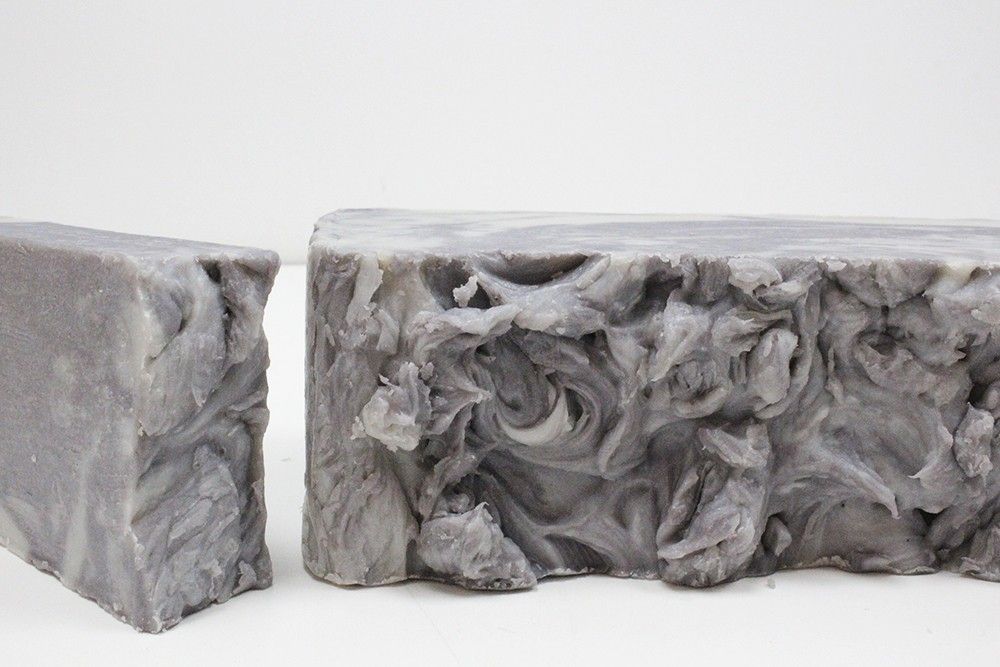 Large artisan olive oil soap loaf textured with dark mineral-rich Dead Sea mud.
