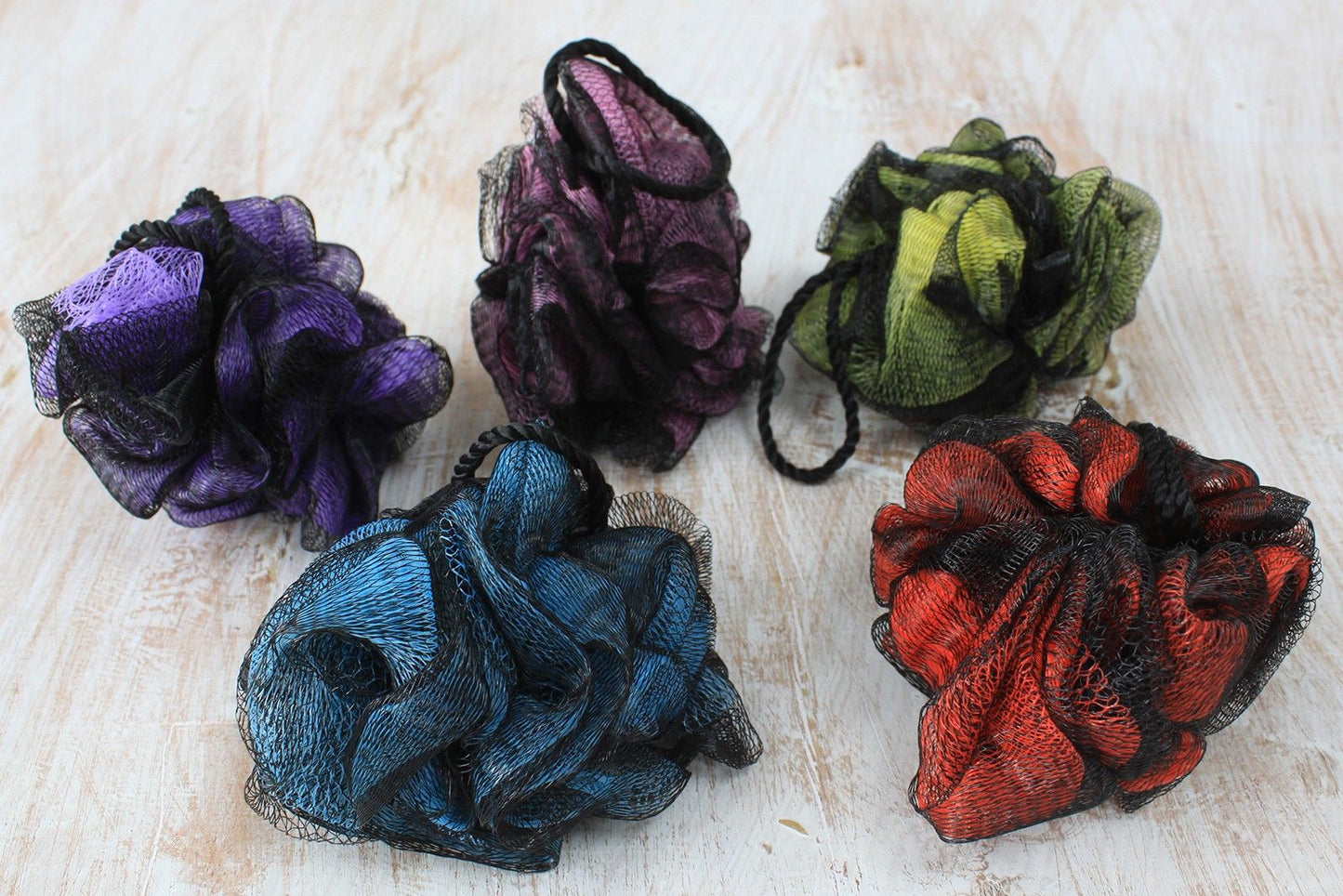 Soft and fluffy luxury bath scrunchie in a vibrant assorted colour for gentle skin exfoliation.