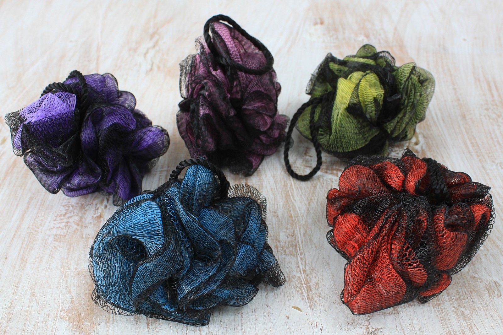 Soft and fluffy luxury bath scrunchie in a vibrant assorted colour for gentle skin exfoliation.