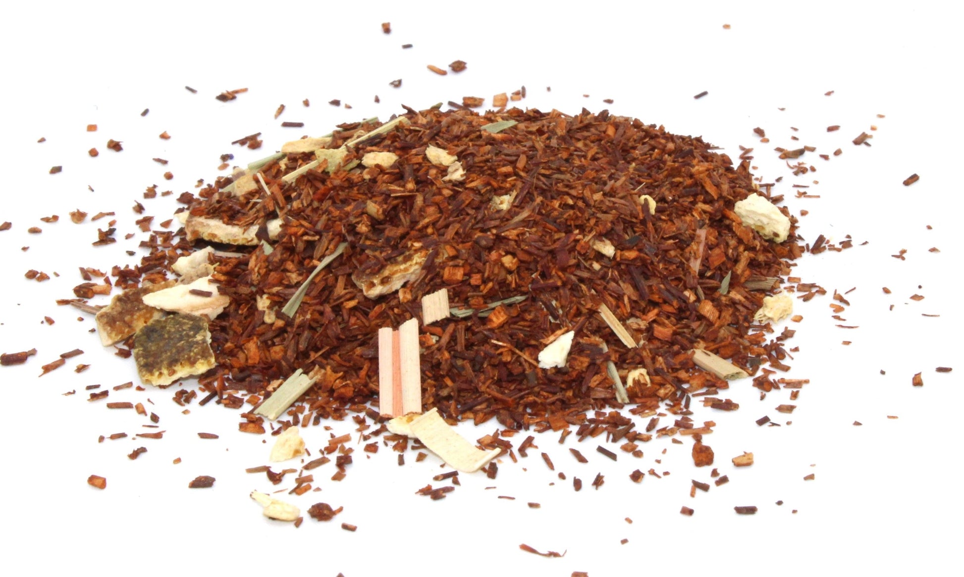 Loose leaf rooibos tea blend with dried orange peel and ginger pieces in a simple glass bowl.