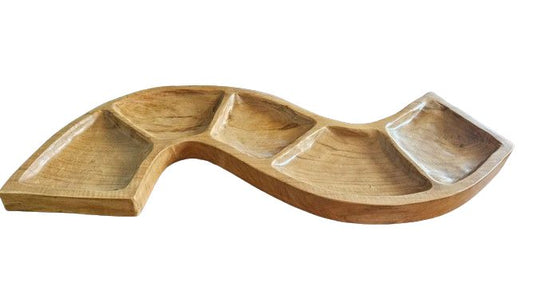 Handcrafted teak root serving bowl with a fluid serpentine design and multiple natural wood compartments.