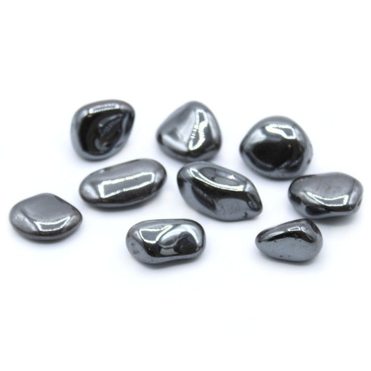 Large, smooth, and highly polished metallic silver-grey Hematite tumbled stones showing a bright reflective finish.