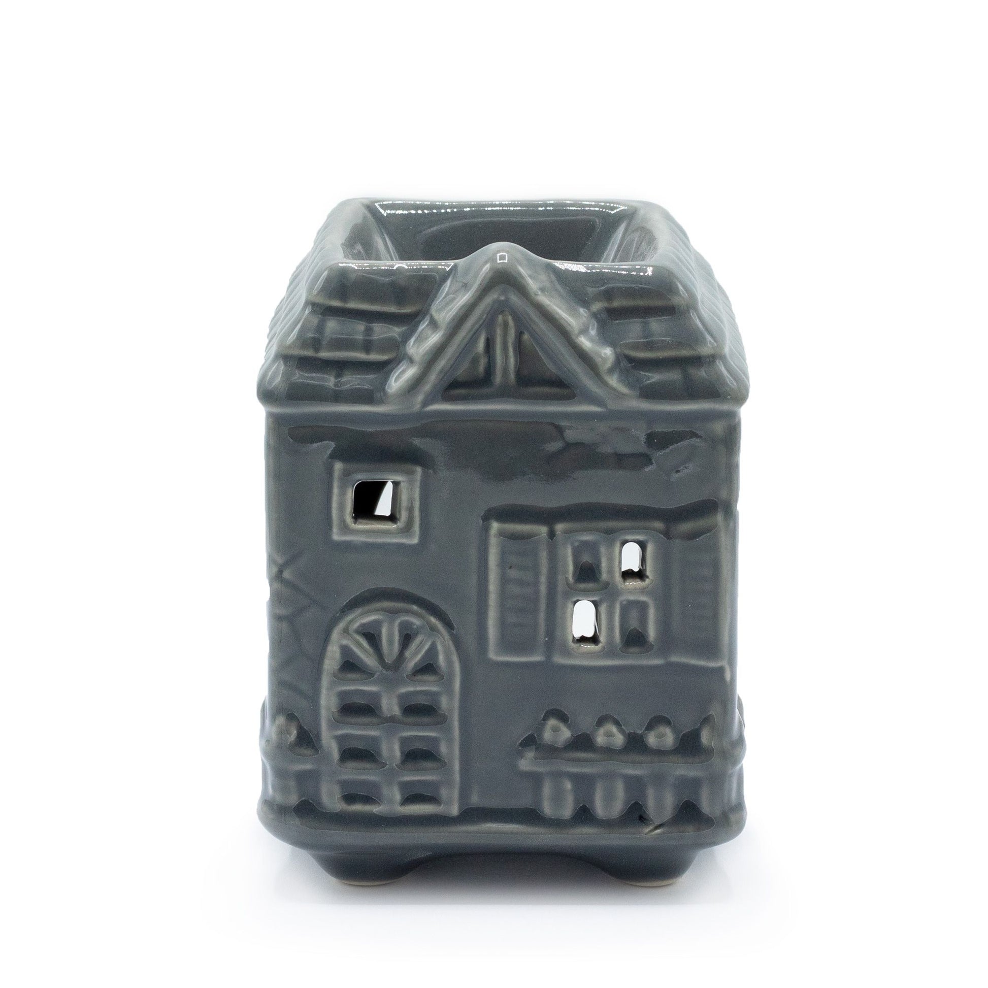Charming grey ceramic oil burner shaped like a townhouse with windows for light to shine through.