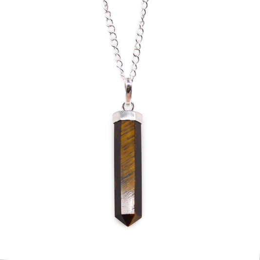 Polished Tiger Eye gemstone carved into a classic hexagonal pointed pendant with a silver-toned bail.