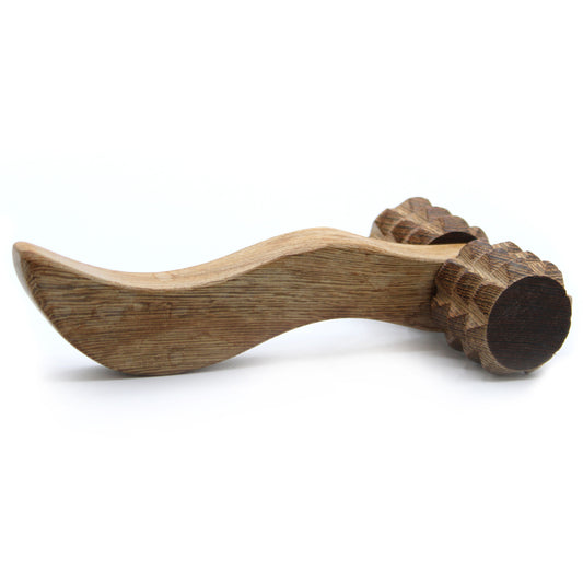 Handheld redwood massage tool with a contoured handle and textured ribbed rollers for muscle relief.