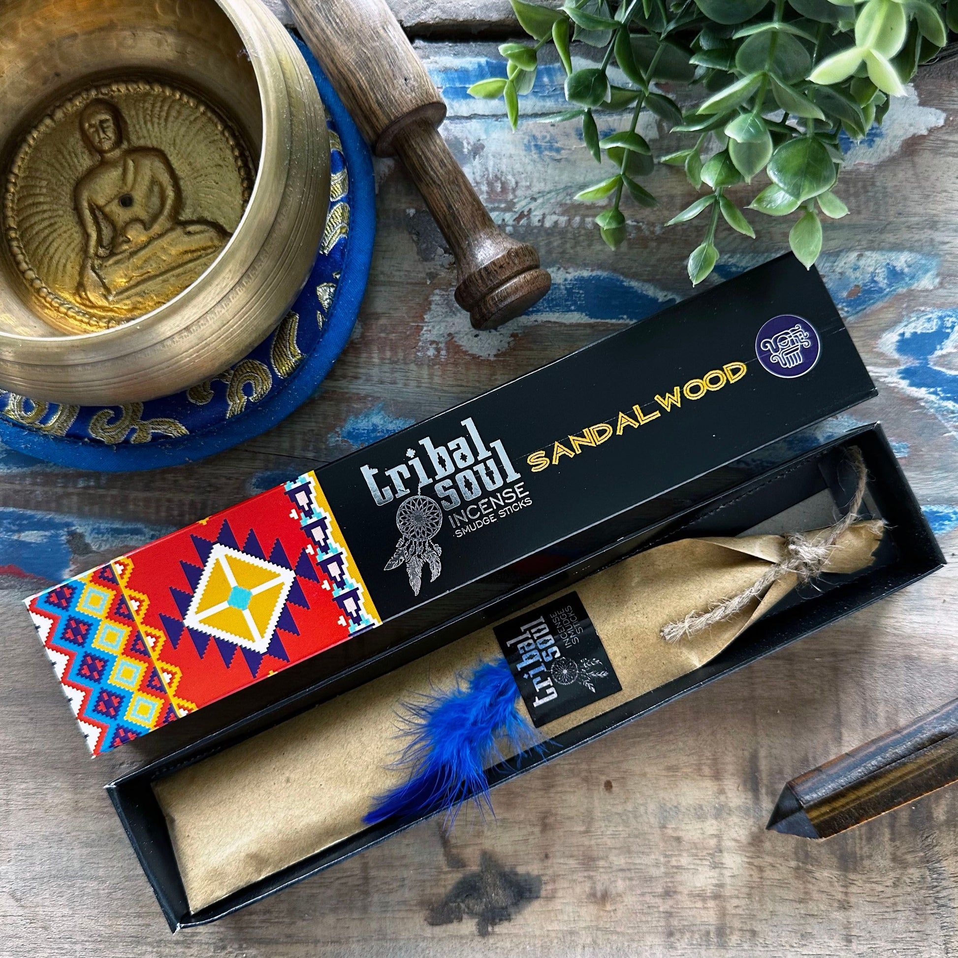 A decorative box of premium sandalwood incense sticks with a traditional design and natural earthy tones.