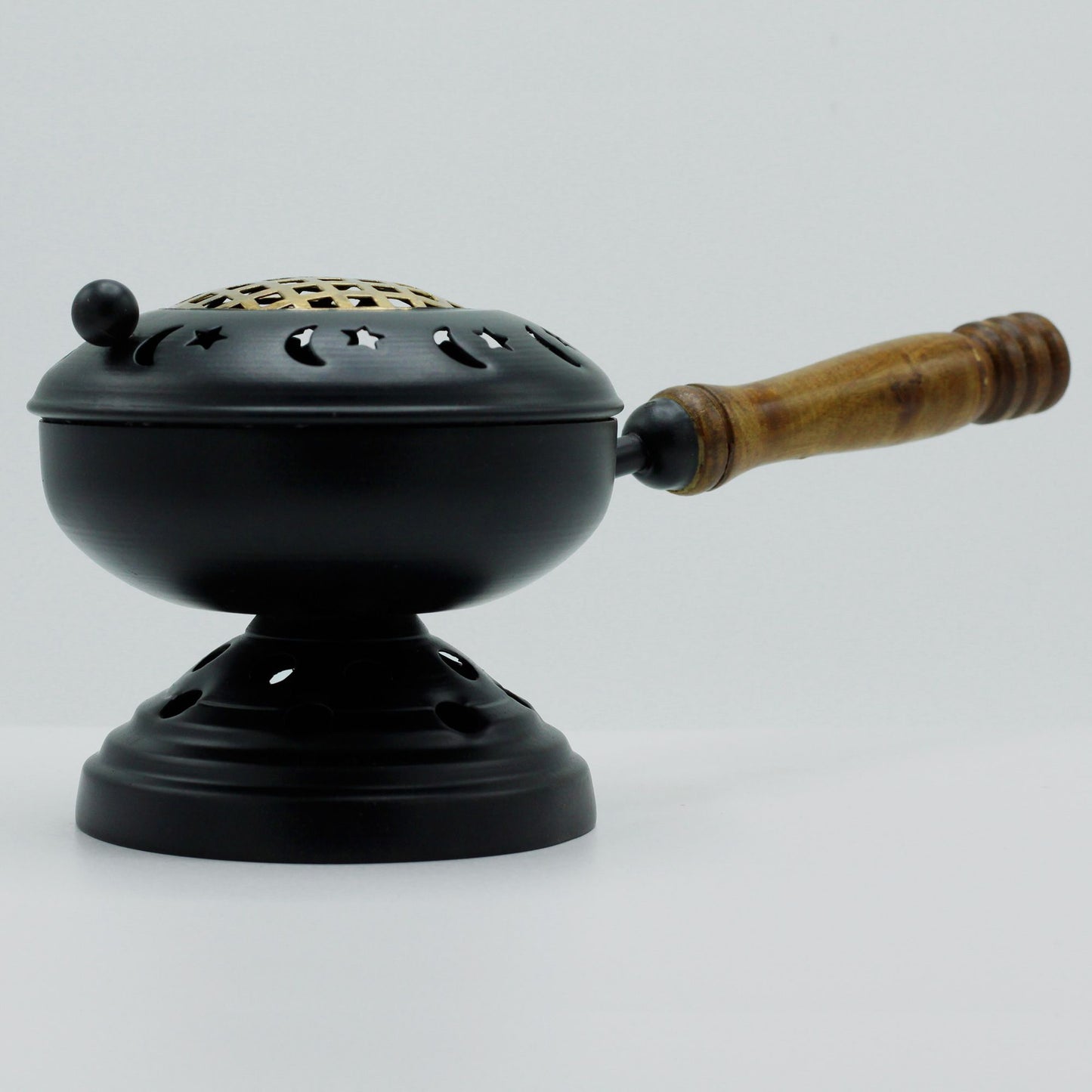 Large black iron censer incense burner featuring gold accents and an elevated tripod stand.