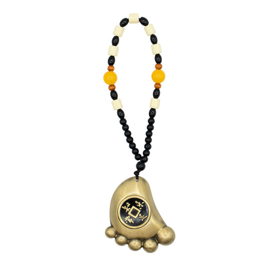 Solid brass foot-shaped amulet hanging with a traditional Chinese wealth coin set into the centre.