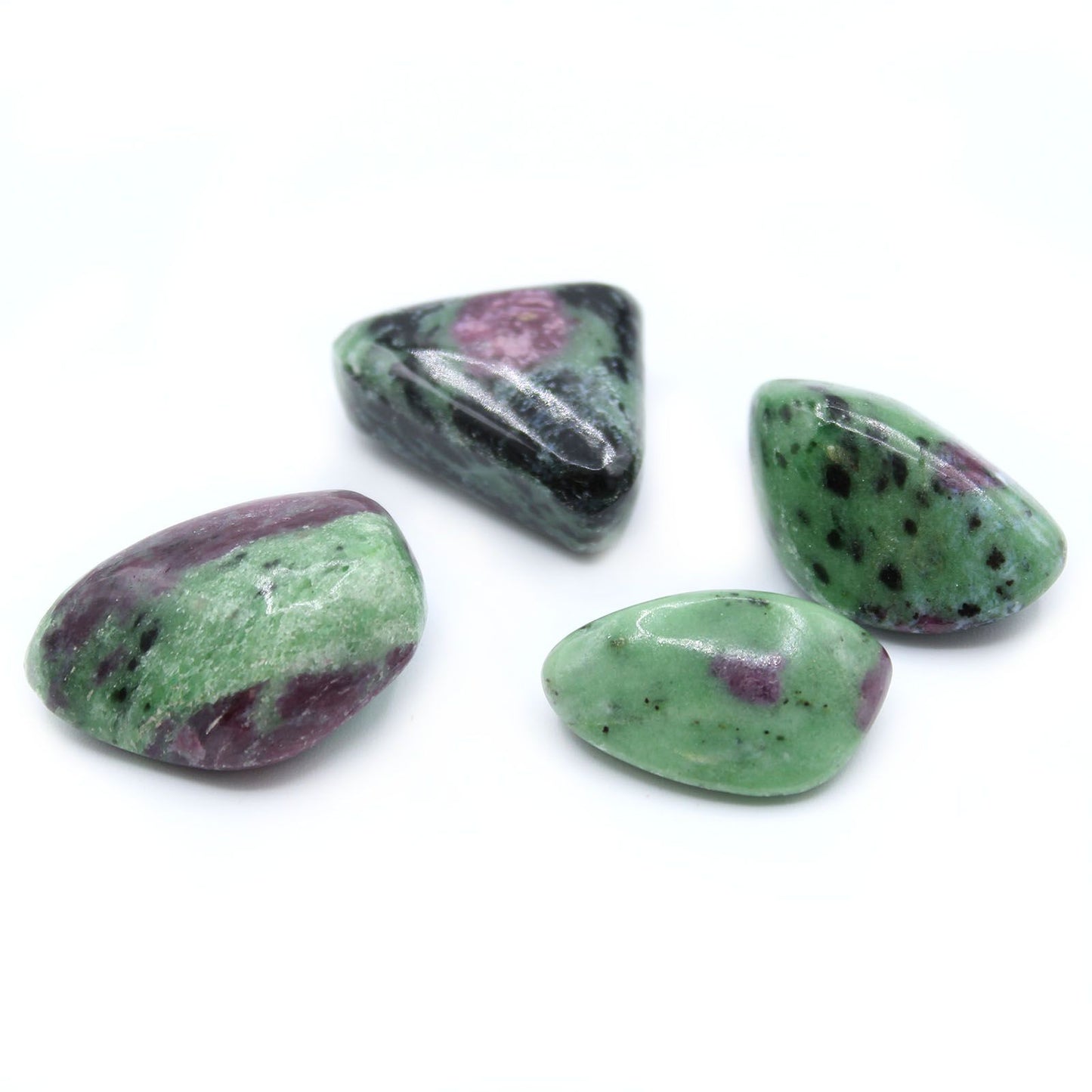 Polished earthy green tumble stone with distinct vibrant pink and red ruby inclusions.