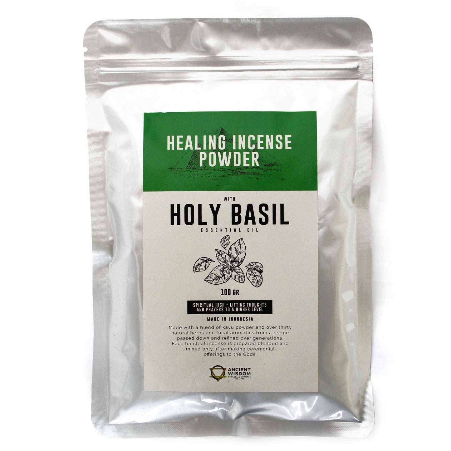Fine green herbal incense powder in a pile, featuring dried holy basil leaves for spiritual cleansing.