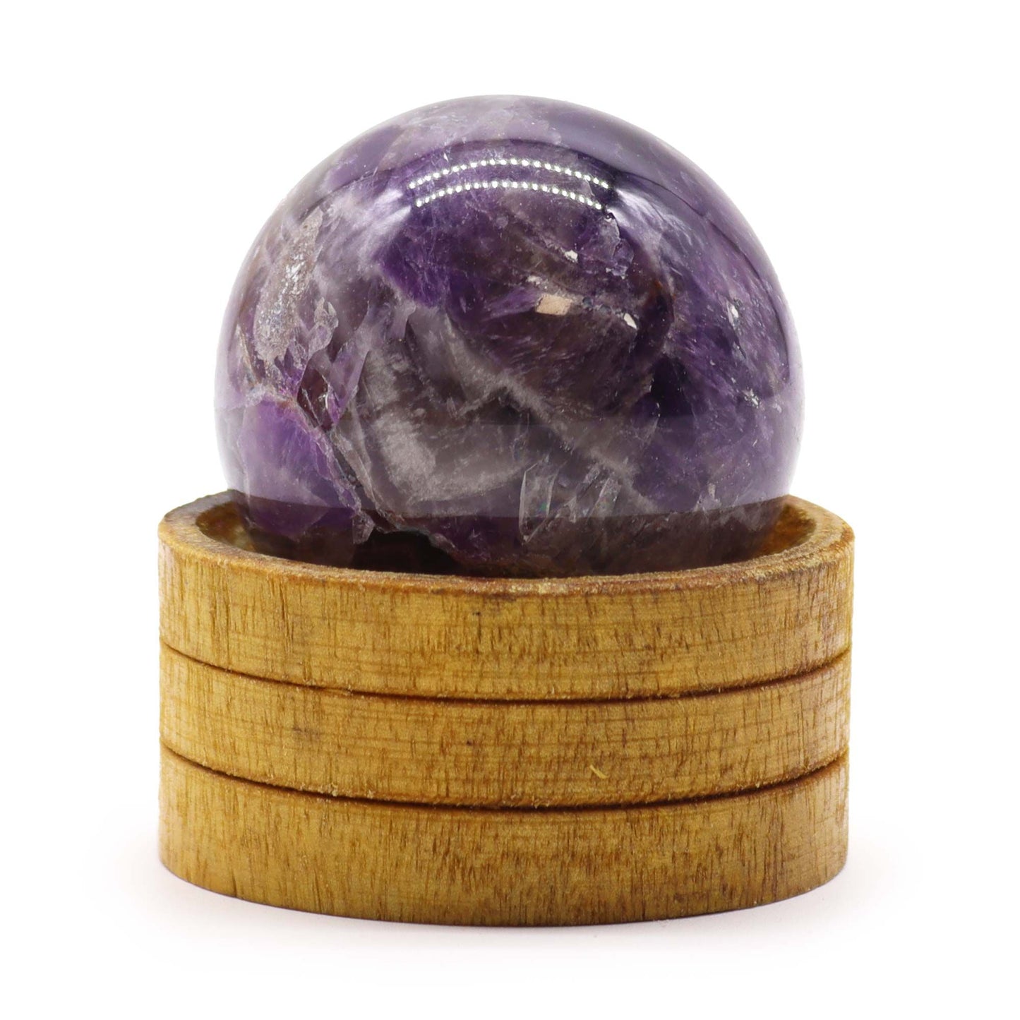 Polished deep purple African Amethyst crystal sphere resting on a simple display stand.