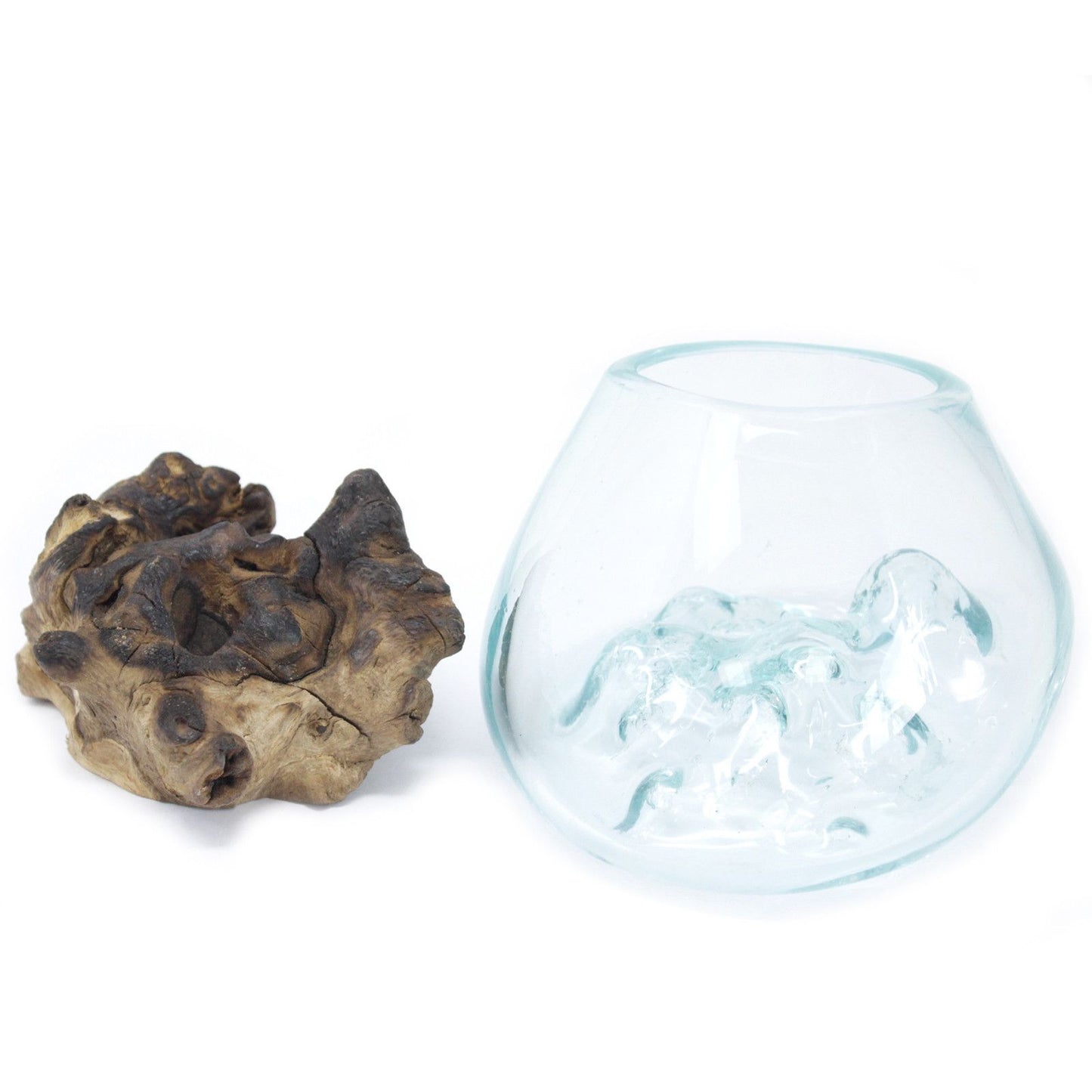 Small handmade bowl made of recycled molten glass fluidly shaped over a natural driftwood base.