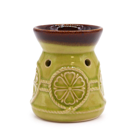 Elegant ceramic oil burner with a smooth jade green finish and a classic spa-style design.
