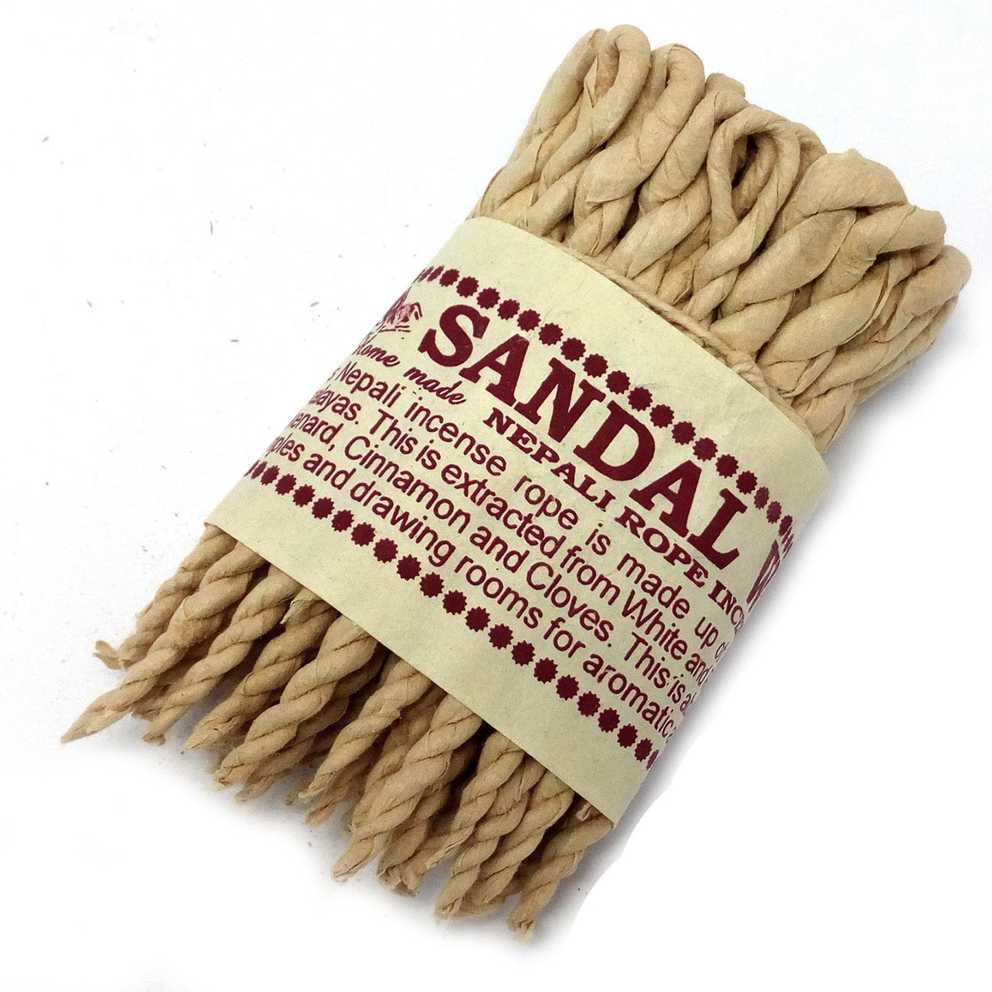 Traditional hand-rolled Nepali rope incense bundle with aromatic Himalayan herbs and spices.
