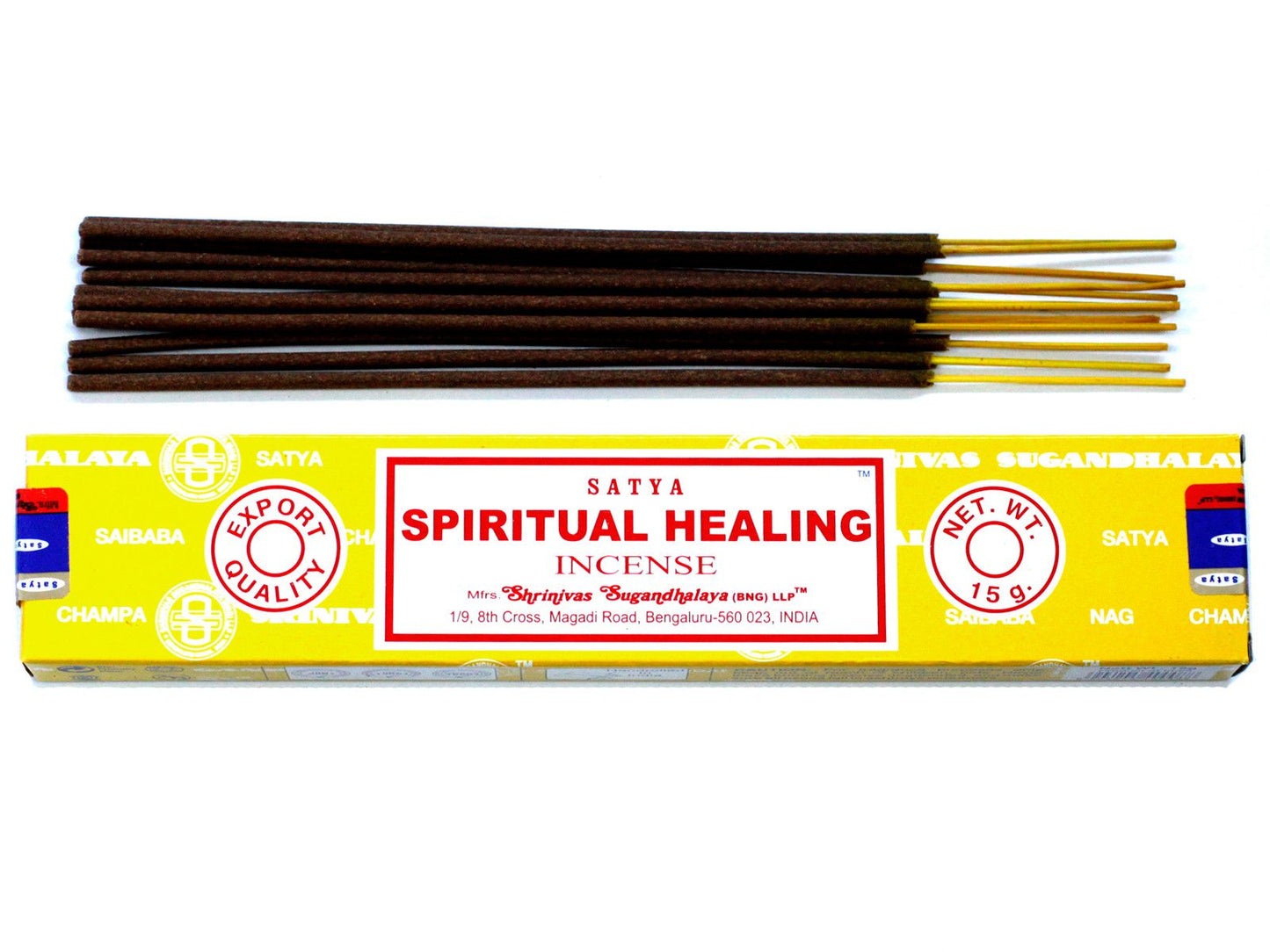 Hand-rolled incense sticks in a blue and white box labelled Spiritual Healing on a wooden surface.